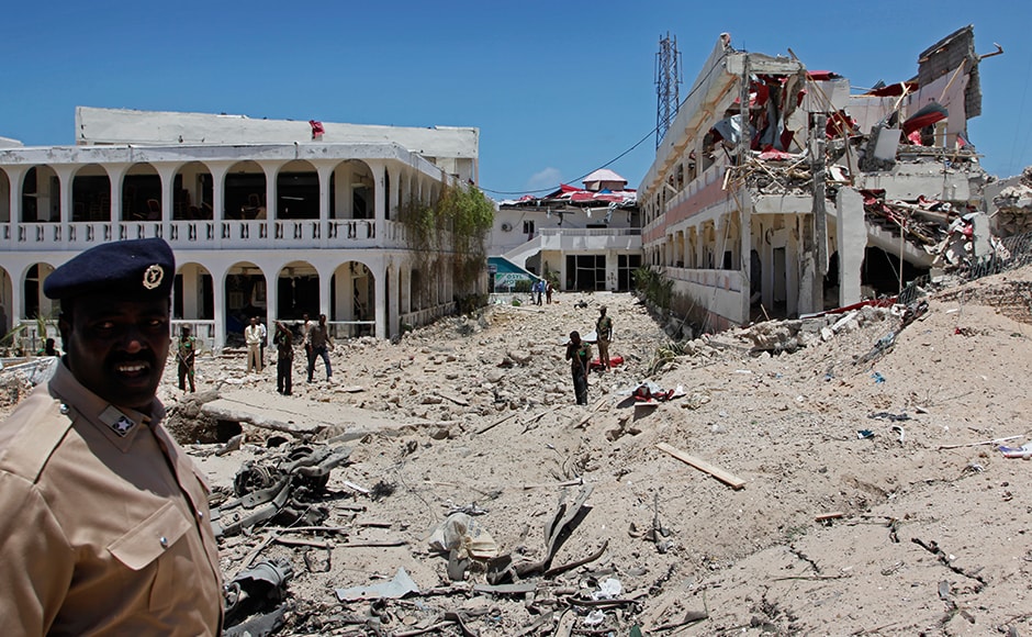 Somali soldiers stand near to a building destroyed by a blast near the presidential palace in the capital Mogadishu, Somalia Tuesday, Aug. 30, 2016. A suicide bomber has detonated an explosives-laden truck near the gate of Somalia's presidential palace in the capital on Tuesday, killing at least 12 people, police say. AP Somali soldiers stand near to a building destroyed by a blast near the presidential palace in the capital Mogadishu, Somalia Tuesday, Aug. 30, 2016. A suicide bomber has detonated an explosives-laden truck near the gate of Somalia's presidential palace in the capital on Tuesday, killing at least 12 people, police say. AP