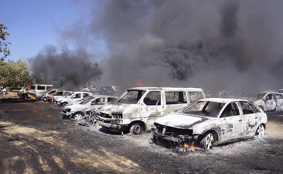 The parking lot resembles a vehicle graveyard after the wildfire gutted 422 cars. AP The parking lot resembles a vehicle graveyard after the wildfire gutted 422 cars. AP