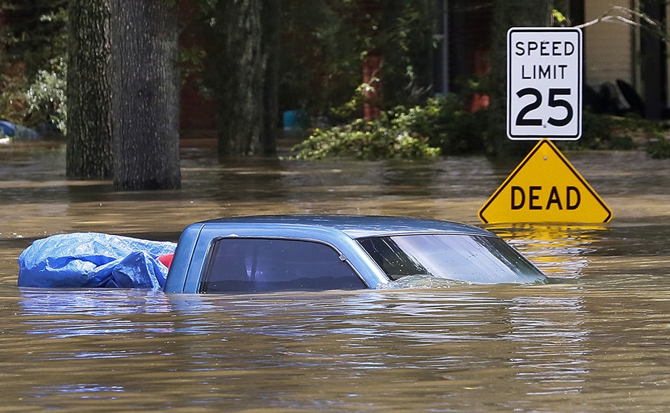 Television images showed residential areas covered in several feet of water, with cars and homes partially submerged. More than 20,000 people had to vacate their homes. Photo: Reuters Television images showed residential areas covered in several feet of water, with cars and homes partially submerged. More than 20,000 people had to vacate their homes. Photo: Reuters