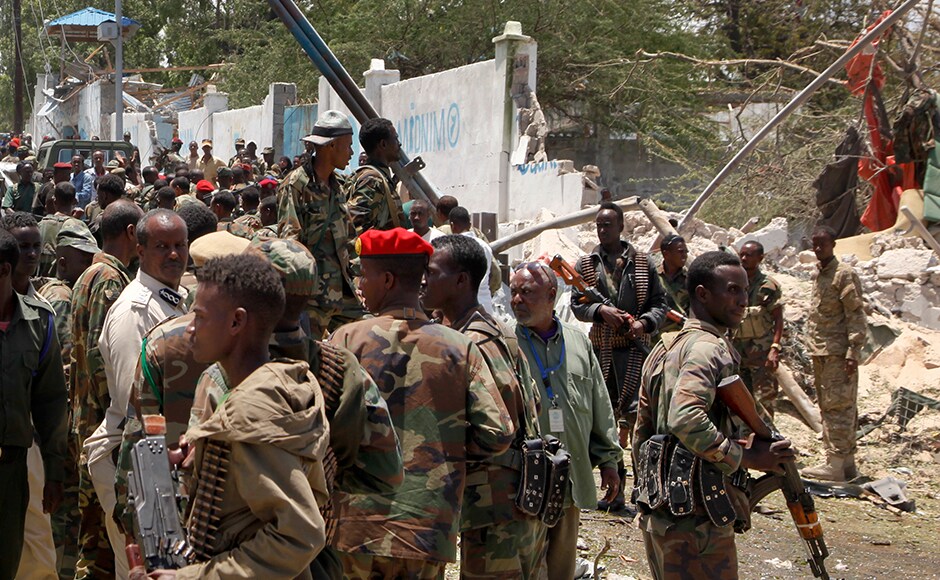 Somali soldiers gathered following the blast while they tried to stop the bomber who used back roads before he sped through checkpoints near the presidential palace and detonated the bomb. The bomber reportedly reached near the gate of the state house with flat tires, according to police sources. AP Somali soldiers gathered following the blast while they tried to stop the bomber who used back roads before he sped through checkpoints near the presidential palace and detonated the bomb. The bomber reportedly reached near the gate of the state house with flat tires, according to police sources. AP