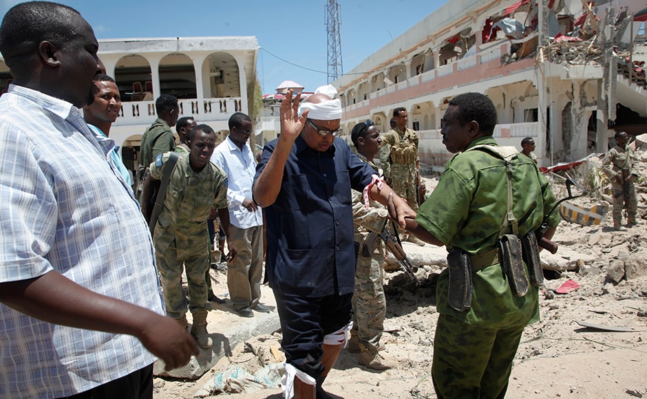 A soldier helps Somali lawmaker Abdalla Bos Ahmed, center, after he was injured by a blast near the presidential palace in the capital Mogadishu which was claimed by an insurgent group al-Shabab. While al-Shabab has been ousted from most of Somalia's cities, it continues to carry out bombings and suicide attacks, notably in the capital. A soldier helps Somali lawmaker Abdalla Bos Ahmed, center, after he was injured by a blast near the presidential palace in the capital Mogadishu which was claimed by an insurgent group al-Shabab. While al-Shabab has been ousted from most of Somalia's cities, it continues to carry out bombings and suicide attacks, notably in the capital.