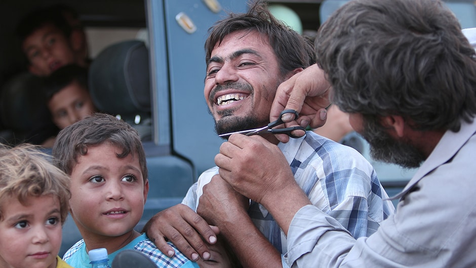 While the women folk set their black robes on fire, men who had lived for weeks under a shaving ban, cut their beards. Reuters While the women folk set their black robes on fire, men who had lived for weeks under a shaving ban, cut their beards. Reuters