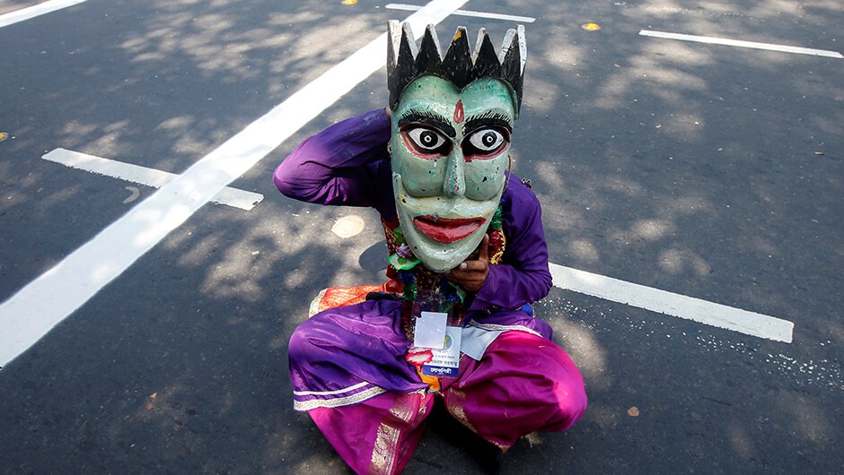 Ahead of India's Independence Day celebration, preparations are on as an artist adjusts his mask before taking part in the full-dress rehearsal in Kolkata. Re Ahead of India's Independence Day celebration, preparations are on as an artist adjusts his mask before taking part in the full-dress rehearsal in Kolkata. Re