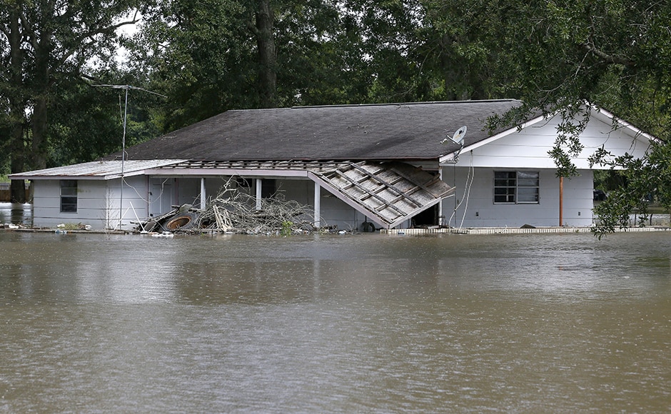 Floods ravaged US state of Louisiana, leaving six people dead. Thousands were forced to flee as water level rose after days of rainfall. Photo: Reuters Floods ravaged US state of Louisiana, leaving six people dead. Thousands were forced to flee as water level rose after days of rainfall. Photo: Reuters