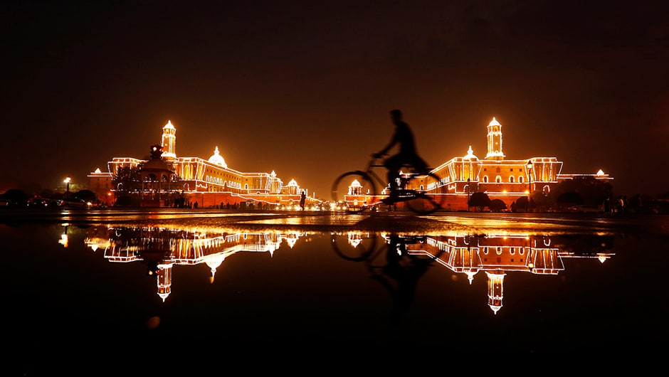 A cyclist rides past the illuminated Raisina Hills ahead of India's Independence Day celebrations in New Delhi, India. Reuters A cyclist rides past the illuminated Raisina Hills ahead of India's Independence Day celebrations in New Delhi, India. Reuters