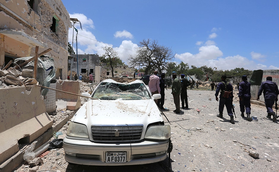 The massive blast left a trail of destruction across the hilltop presidential complex and to nearby hotels. The bombing tore into blast walls protecting hotels and blew off the roofs of nearby houses. Somali government forces walk past a car destroyed as they arrive to secure the scene of the bombing. Reuters The massive blast left a trail of destruction across the hilltop presidential complex and to nearby hotels. The bombing tore into blast walls protecting hotels and blew off the roofs of nearby houses. Somali government forces walk past a car destroyed as they arrive to secure the scene of the bombing. Reuters