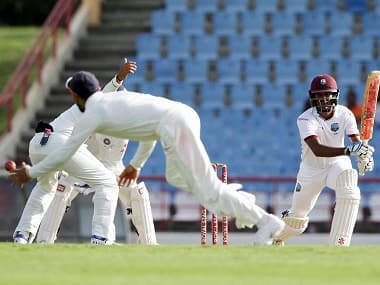 Gros Islet : India's captain Virat Kohli, back to camera, fields a shot played by West Indies' batsman Kraigg Brathwaite during day two of their third cricket Test match at the Daren Sammy Cricket Ground in Gros Islet, St. Lucia, Wednesday, Aug. 10, 2016. AP/PTI(AP8_11_2016_000008B)