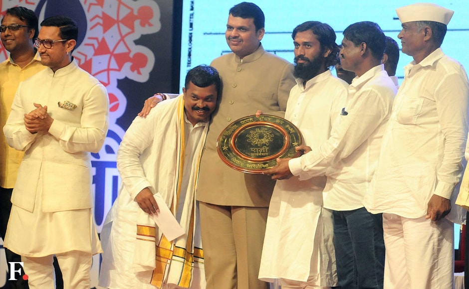The first prize worth Rs 50 lakhs went to Velu village in Koregaon tehsil. Second prize of Rs 30 lakhs was shared by Khapartone and Jaigaon villages in Ambejogai and Koregaon tehsils, respectively. Aamir Khan and Devendra Fadnavis felicitated the awards. Sachin Gokhale/Firstpost The first prize worth Rs 50 lakhs went to Velu village in Koregaon tehsil. Second prize of Rs 30 lakhs was shared by Khapartone and Jaigaon villages in Ambejogai and Koregaon tehsils, respectively. Aamir Khan and Devendra Fadnavis felicitated the awards. Sachin Gokhale/Firstpost