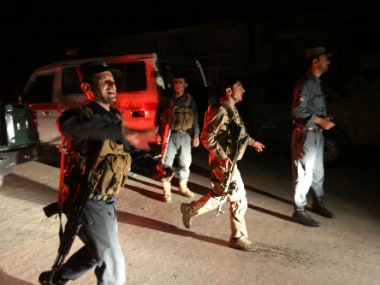 Afghan security forces rush to respond to a complex Taliban attack on the campus of the American University in Kabul on Wednesday. AP