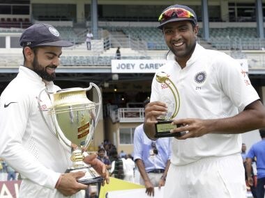 Virat Kohli and Ravichandran Ashwin celebrate India's test series win in WI.