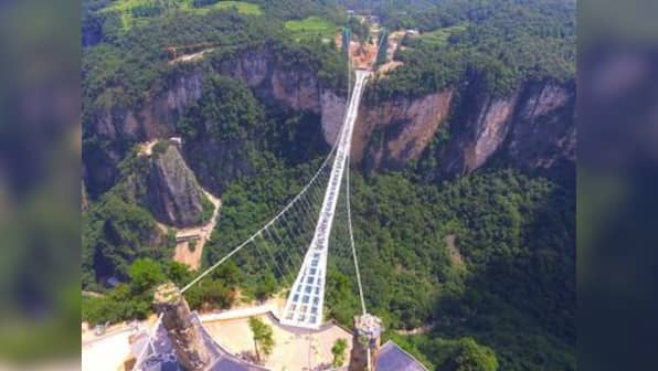 Dare to look down: China launches world's longest and highest glass-bottomed bridge