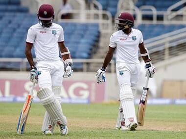 West Indies' Rajendra Chandrika (right) walks pass teammate Kraigg Brathwaite. AP