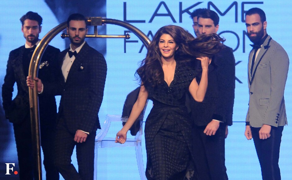 Jacqueline Fernandez, the brand ambassador for TRESemmé India, was the showstopper. She sizzled the runway dressed in a black draped knee length dress. Sachin Gokhale/Firstpost Jacqueline Fernandez, the brand ambassador for TRESemmé India, was the showstopper. She sizzled the runway dressed in a black draped knee length dress. Sachin Gokhale/Firstpost