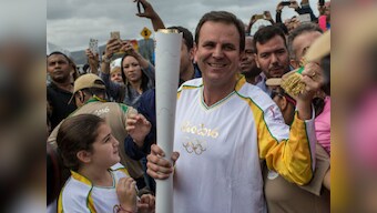 Rio 2016: Olympic torch passes through host city amid samba, protests