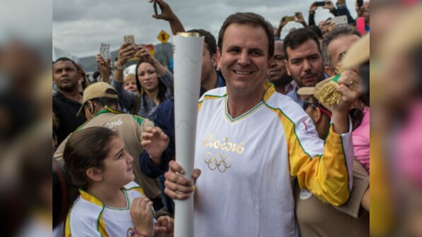 Rio 2016: Olympic torch passes through host city amid samba, protests
