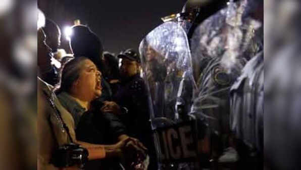 Shots fired in peaceful Ferguson gathering after car hits protester