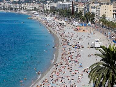 Corsica becomes third French city to ban burqini after beach clashes