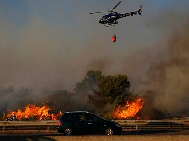 Wildfires in Southern France and Portugal force evacuation of more than 1,000 people