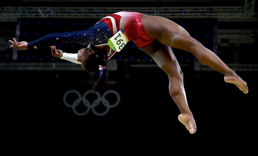 Simone Biles competes on the balance beam during the Artistic Gymnastics Women's Team Final. Getty
