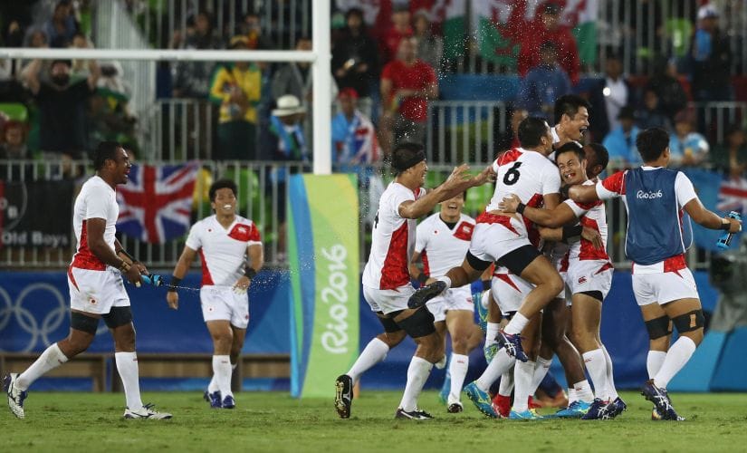 Japan celebrate after the Men's Quarter-final 2 against France. Getty