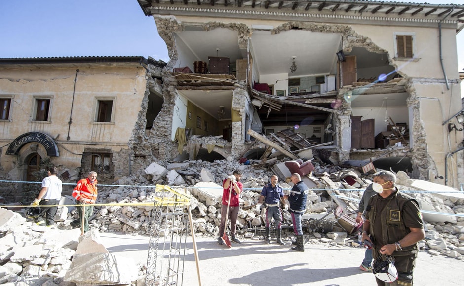 Rescuers stand by a collapsed house following an earthquake in Amatrice, central Italy on Wednesday, 24 August, 2016. A strong earthquake in central Italy reduced three towns to rubble as people slept early Wednesday. AP Rescuers stand by a collapsed house following an earthquake in Amatrice, central Italy on Wednesday, 24 August, 2016. A strong earthquake in central Italy reduced three towns to rubble as people slept early Wednesday. AP