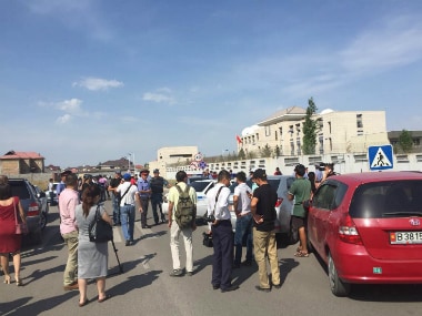 This photo was released by China's Xinhua News Agency, people gather near the site of the explosion in Bishkek, Kyrgyzstan on Tuesday. AP