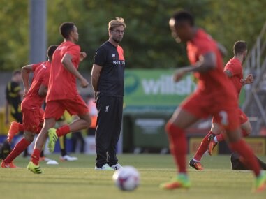 Liverpool's manager Jurgen Klopp watches his players warm up. AFP