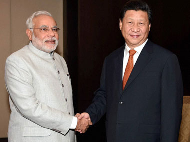 China President Xi Jinping with Prime Minister Narendra Modi. PTI