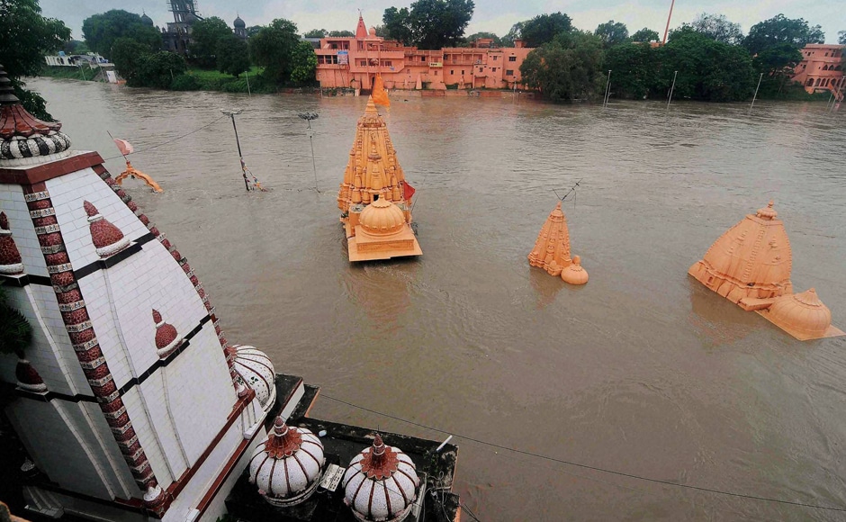 Torrential rains continue to lash Madhya Pradesh even as relief work has gained momentum. Normal life has been affected in Ujjain and other western parts of the state. Temples are also submerged at Ram ghat due to heavy rains which caused floods in Kshipra river in Ujjain. Photo: PTI Torrential rains continue to lash Madhya Pradesh even as relief work has gained momentum. Normal life has been affected in Ujjain and other western parts of the state. Temples are also submerged at Ram ghat due to heavy rains which caused floods in Kshipra river in Ujjain. Photo: PTI