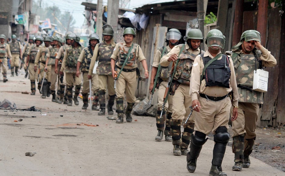 Security personnel patrol a deserted street after curfew was imposed following fresh clashes, at Batamallo in Srinagar. Clashes were reported from a number of places in Srinagar city but nobody was hurt in these incidents. PTI Security personnel patrol a deserted street after curfew was imposed following fresh clashes, at Batamallo in Srinagar. Clashes were reported from a number of places in Srinagar city but nobody was hurt in these incidents. PTI