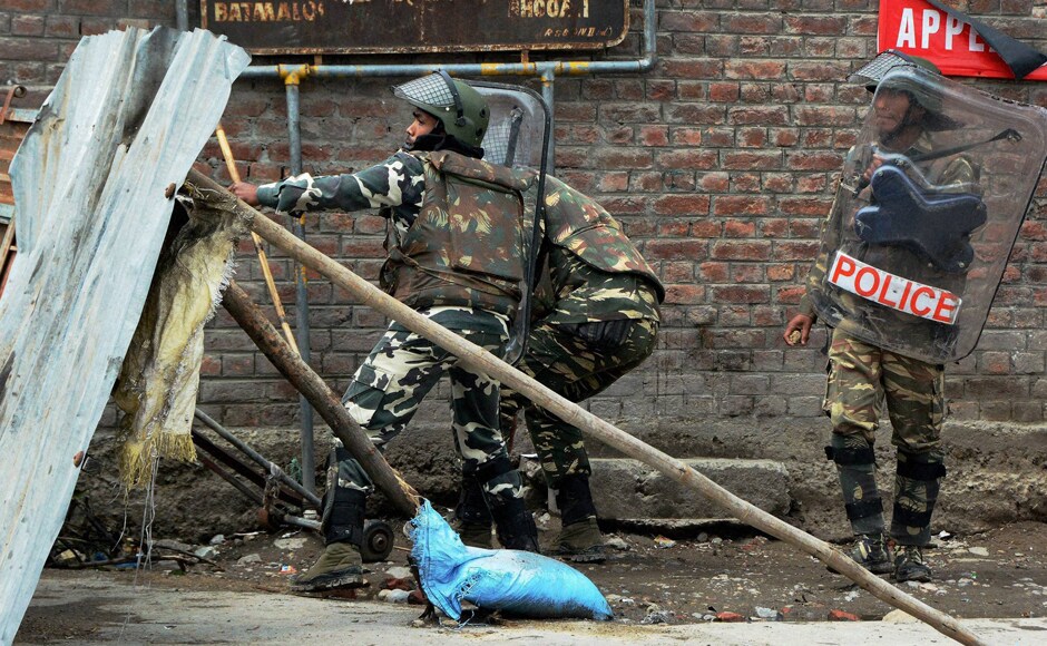 Security forces in action against protesters during a clash in Srinagar. Curfew was clamped in the Valley on 9 July following violence in the aftermath of Wani's killing in an encounter in south Kashmir's Anantnag district on 8 July. PTI Security forces in action against protesters during a clash in Srinagar. Curfew was clamped in the Valley on 9 July following violence in the aftermath of Wani's killing in an encounter in south Kashmir's Anantnag district on 8 July. PTI