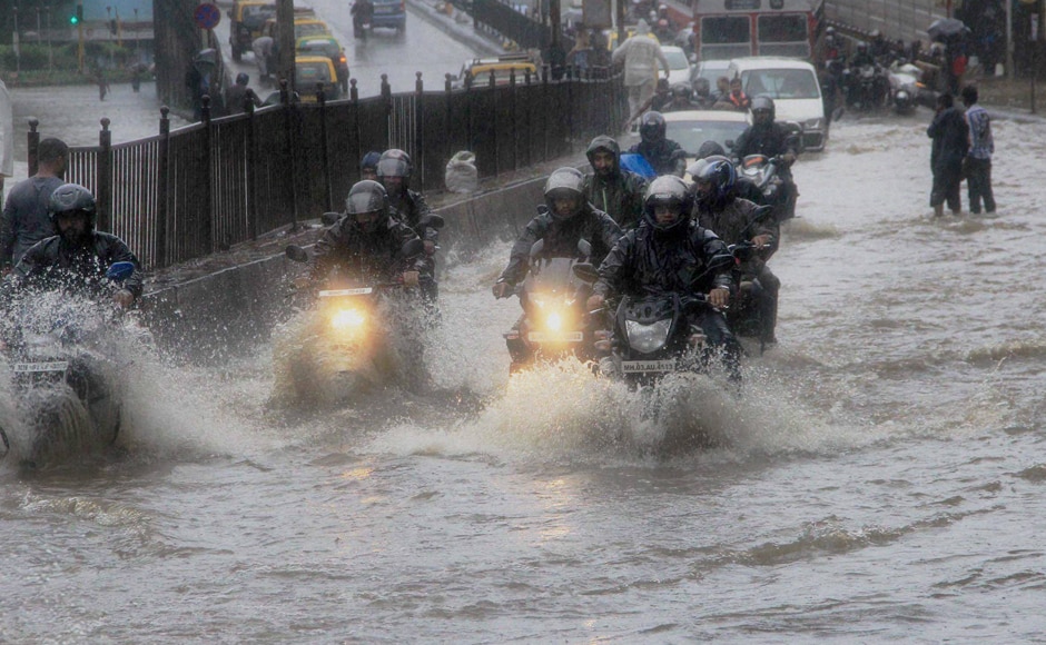 The downpour led to waterlogging in parts of south and central Mumbai, as well as the eastern and western suburbs, leading to major traffic snarls. Vehicles had to wade through flooded streets during peak traffic hours. PTI The downpour led to waterlogging in parts of south and central Mumbai, as well as the eastern and western suburbs, leading to major traffic snarls. Vehicles had to wade through flooded streets during peak traffic hours. PTI