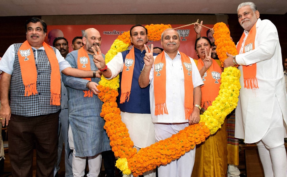 Nitin Patel, Deputy Chief Minister (on the right) name gained more circulation. But in the end, it was Rupani with his non-controversial, low-profile and sincere organisational man credentials which prevailed. PTI Nitin Patel, Deputy Chief Minister (on the right) name gained more circulation. But in the end, it was Rupani with his non-controversial, low-profile and sincere organisational man credentials which prevailed. PTI
