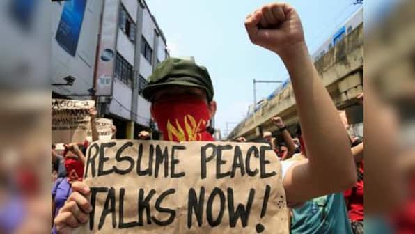 Philippines frees top communist leaders to join peace talks