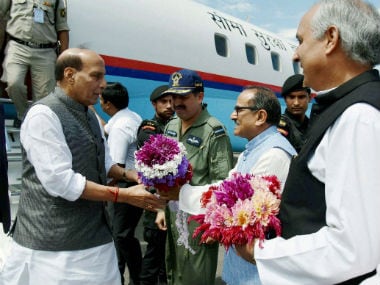 Union minister Rajnath Singh is greeted by Deputy Chief Minister of Jammu and Kashmir Nirmal Singh upon his arrival. PTI