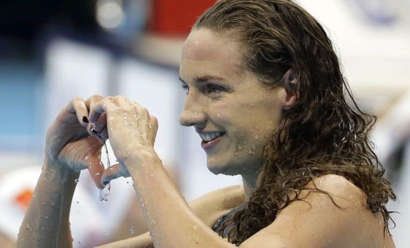 Katinka Hosszu celebrates winning the gold medal in the women's 100-meter backstroke. AP