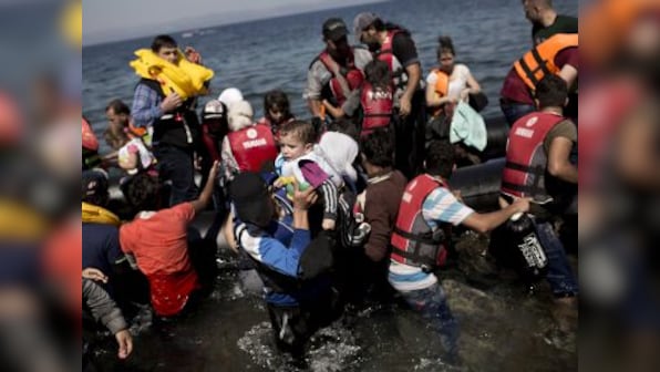 At least 100 migrants rescued after boats ran aground off Greece