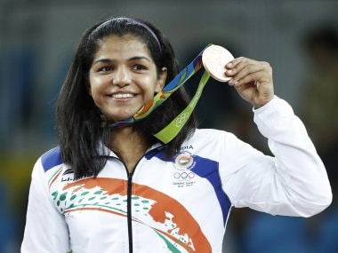 India's bronze medallist Sakshi Malik stands on the podium. AFP