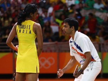 PV Sindhu talks to her coach Gopichand during the Women's Singles Gold Medal Match. Getty