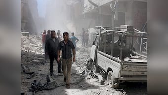 Multiple bomb blasts in Syrian cities kill at least 12 people
