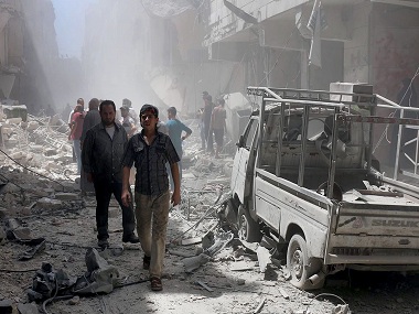 Multiple bomb blasts in Syrian cities kill at least 12 people Multiple bomb blasts in Syrian cities kill at least 12 people