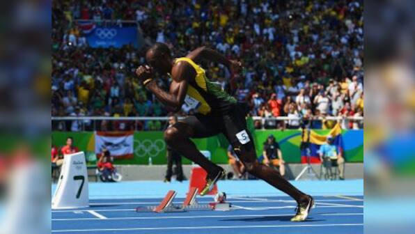 Usain Bolt qualifies for semi-finals of 200m sprint to keep 'triple triple' hopes alive at Rio 2016 Olympics
