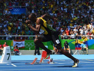 Usain Bolt qualifies for semi-finals of 200m sprint to keep 'triple triple' hopes alive at Rio 2016 Olympics
