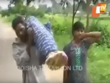 Video: Unable to get vehicle, Odisha man walks 10 km in Kalahandi carrying wife's body Video: Unable to get vehicle, Odisha man walks 10 km in Kalahandi carrying wife's body
