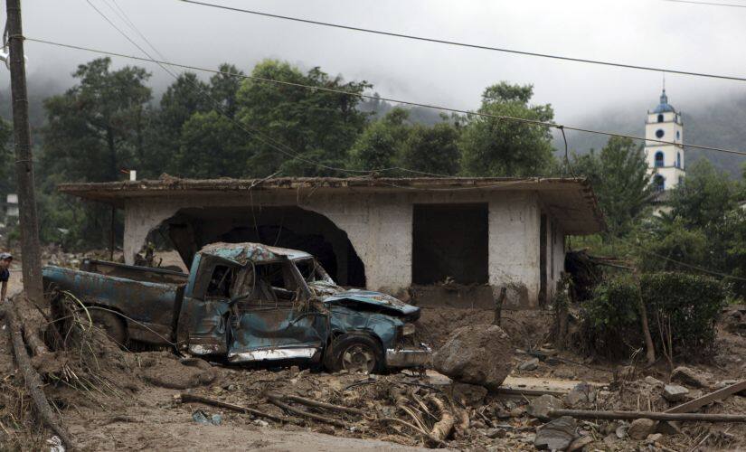 A pickup truck lays destroyed after a mudslide in Xaltepec, on the mountainous north of Puebla state, Mexico. AP