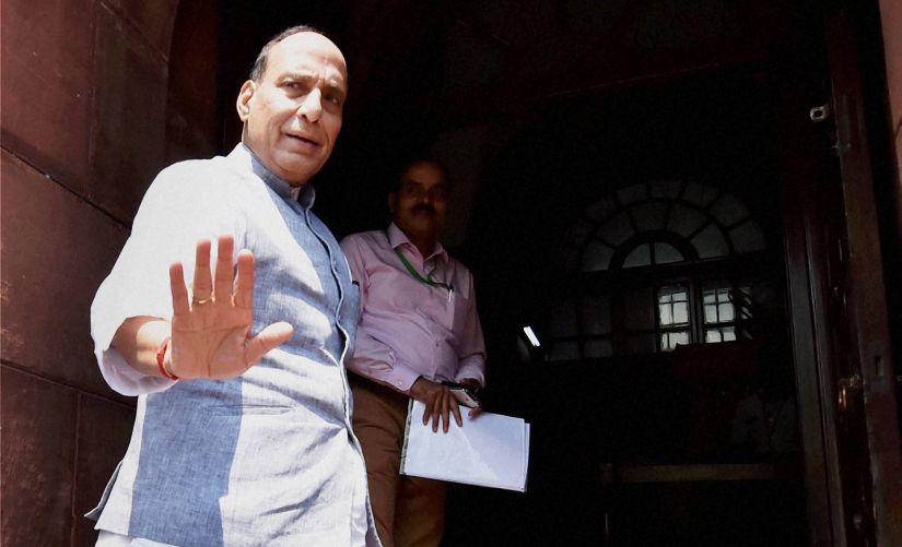 Union Home Minister Rajnath Singh outside the Parliament on Friday. PTI