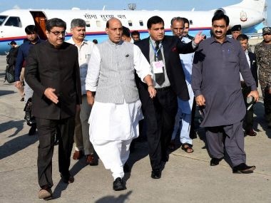 Pakistani officials escort Home Minister Rajnath Singh in Islamabad on Wednesday. AP/PTI