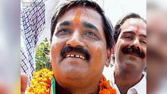 BJP Delhi unit holds demonstration over suppression of CAG report on advertisements by AAP