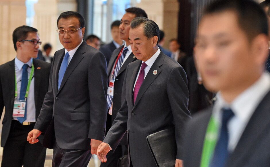 Chinese Premier Li Keqiang (2nd L) walks with Foreign Minister Wang Yi (2nd R) after a meeting session at the Association of Southeast Asian Nations (ASEAN) Summit in Vientiane. The gathering will see the 10 ASEAN members meet by themselves, then with leaders from the US, Japan, South Korea and China. AFP Chinese Premier Li Keqiang (2nd L) walks with Foreign Minister Wang Yi (2nd R) after a meeting session at the Association of Southeast Asian Nations (ASEAN) Summit in Vientiane. The gathering will see the 10 ASEAN members meet by themselves, then with leaders from the US, Japan, South Korea and China. AFP