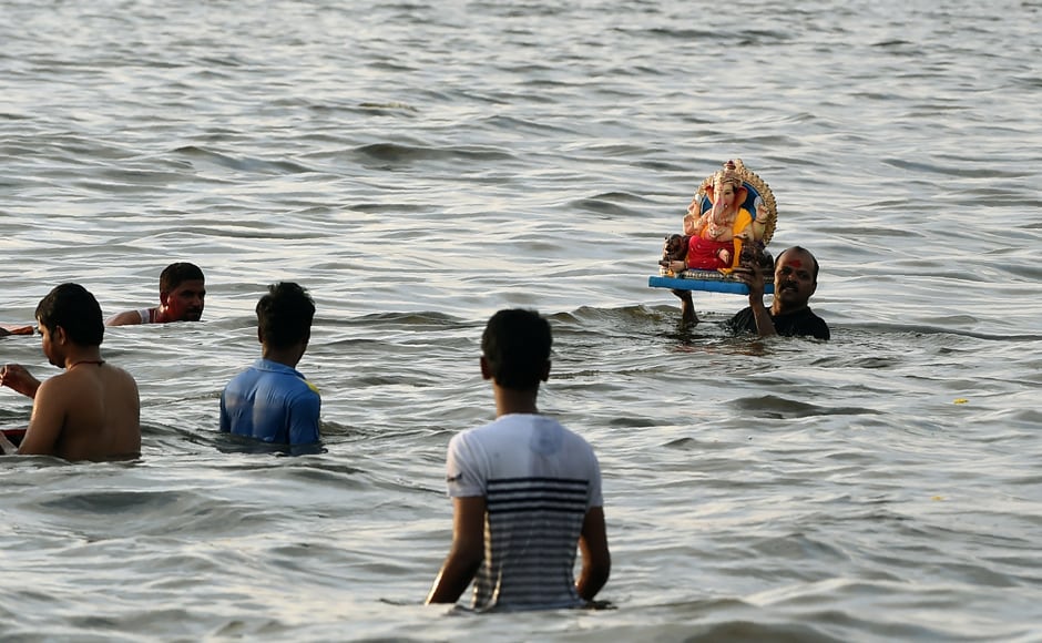 The eleventh day sees millions of Hindus gathering along the western city's coast to immerse the elephant-god idols in the Arabian sea. (Photo courtesy: AFP) The eleventh day sees millions of Hindus gathering along the western city's coast to immerse the elephant-god idols in the Arabian sea. (Photo courtesy: AFP)